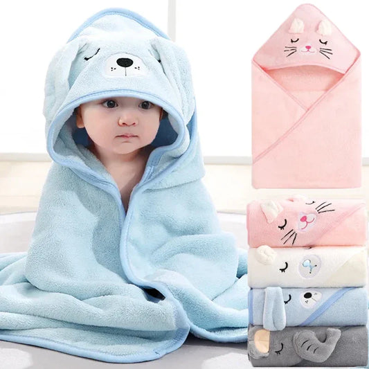Adorable baby in a soft, absorbent coral fleece hooded bath towel with cute animal ears, perfect for newborns.