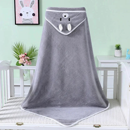A parent gently drying their baby with a soft, absorbent hooded bath towel, ensuring comfort and warmth.