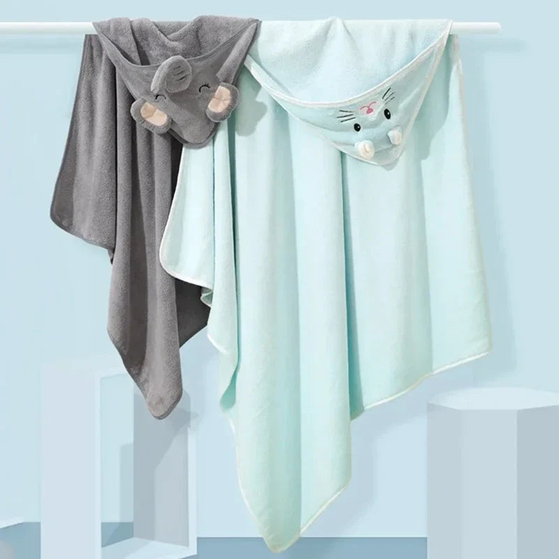 Close-up of a baby's happy face wrapped in a plush animal hooded bath towel, ideal for post-bath snuggles.