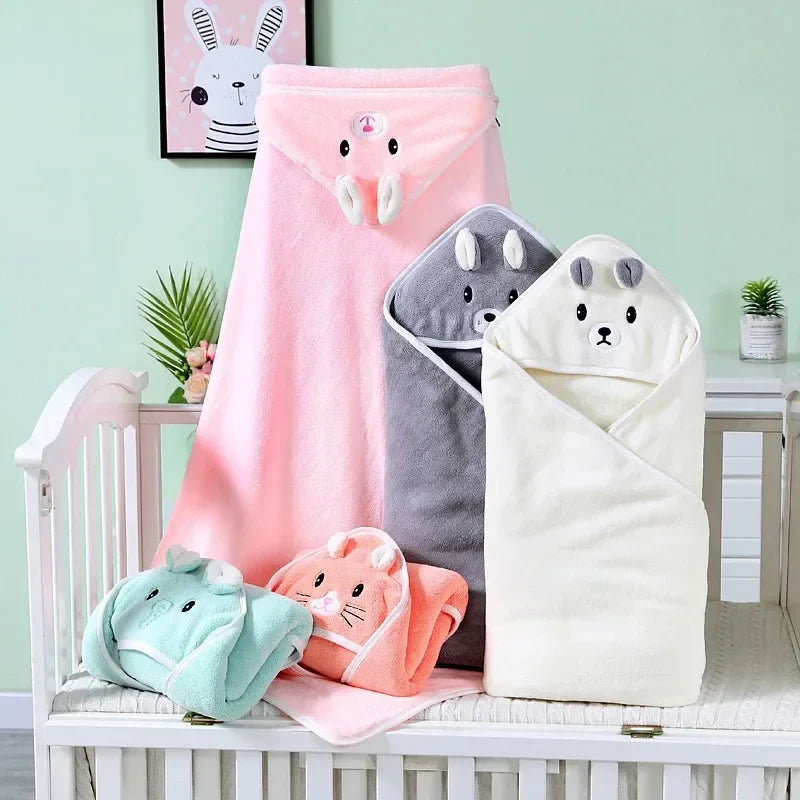 Several colorful coral fleece hooded baby towels with different animal designs, excellent baby shower gifts.