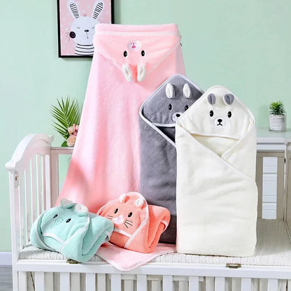 Several colorful coral fleece hooded baby towels with different animal designs, excellent baby shower gifts.