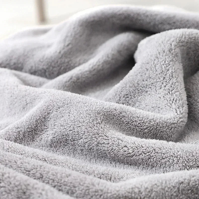 Baby wrapped in a cozy lion-themed hooded bath towel, highlighting the gentle material for delicate skin.