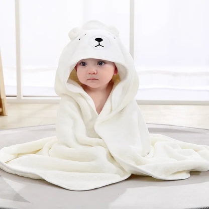 Detail of the soft coral fleece fabric of a baby animal hooded towel, emphasizing its delicate touch.