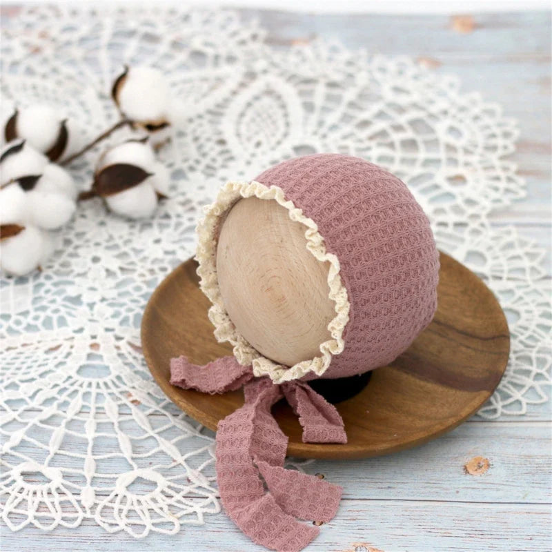 Close-up of the breathable nylon fabric of an infant adjustable beanie cap.
