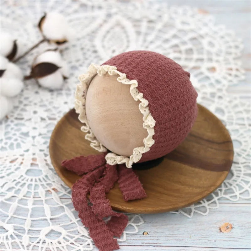 Collection of newborn adjustable nylon hats, emphasizing their versatile use.