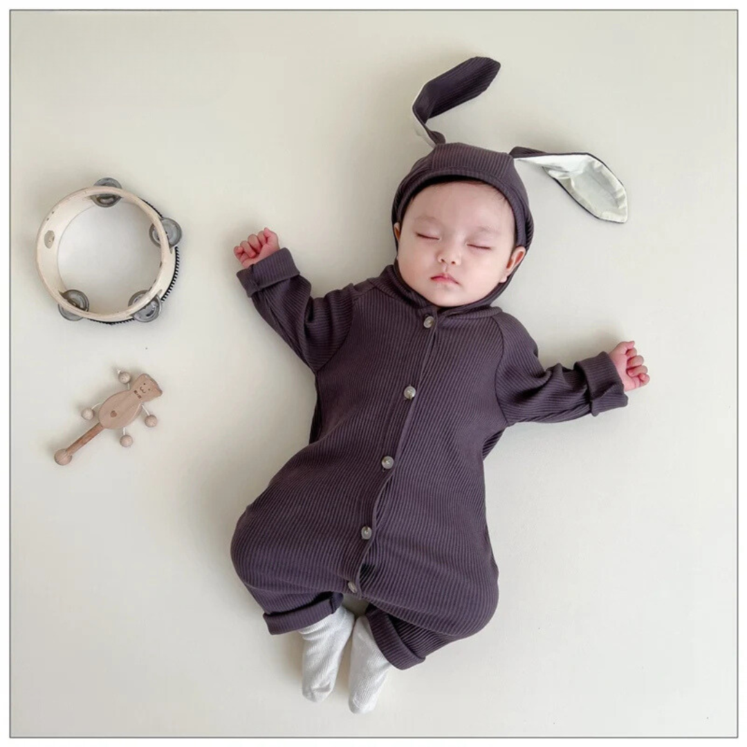 Unisex baby cotton jumpsuit with charming bunny ears and face, ideal infant apparel.