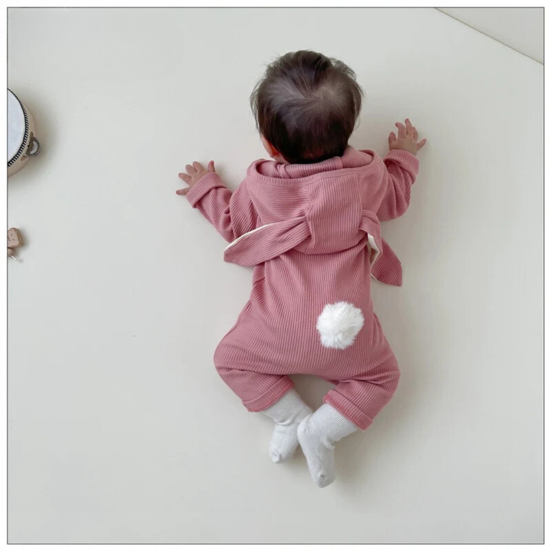 Front view of a white cotton unisex baby romper, showcasing a sweet rabbit embroidery and ears.