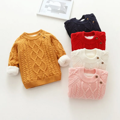 Toddler model wearing a cute cartoon print wool blend sweater, ideal for winter