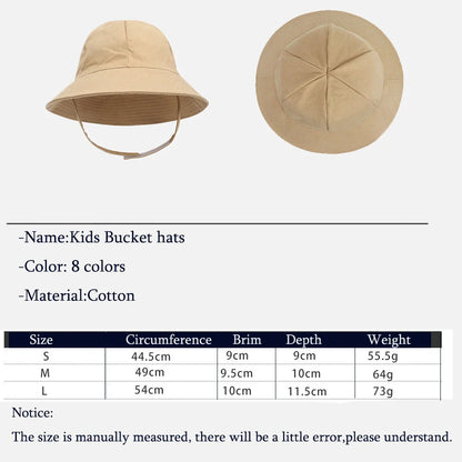 Close-up of the UPF 50+ label on an adjustable kids' sun protection bucket hat, detail shot.
