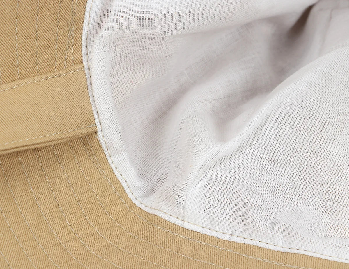 Two babies side-by-side, each wearing a different color adjustable sun protection bucket hat.