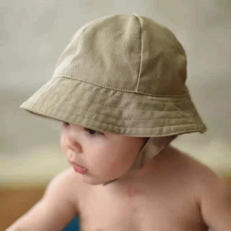 Close-up of a high-quality adjustable sun protection bucket hat for kids in a vibrant yellow.