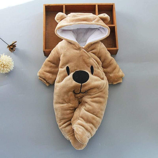 Adorable baby in cozy bear hoodie jumpsuit, perfect for newborn winter warmth.