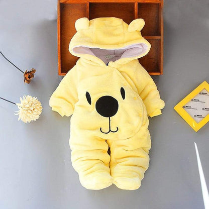 Happy baby crawling in a warm bear hoodie jumpsuit, perfect for winter adventures.