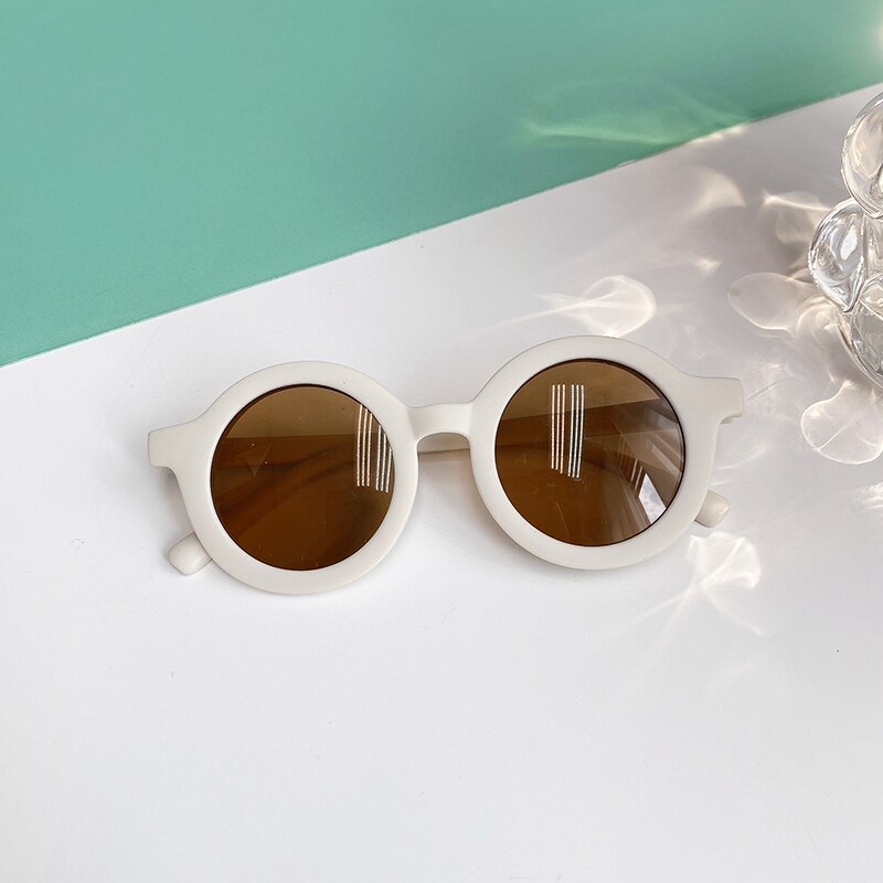 Pair of leopard print baby sunglasses, packaged and ready as a thoughtful baby accessory or gift.