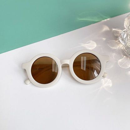 Pair of leopard print baby sunglasses, packaged and ready as a thoughtful baby accessory or gift.