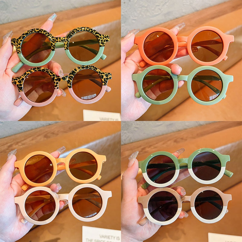 Leopard print baby sunglasses on a baby accessories display, showcasing a popular item and baby gift.