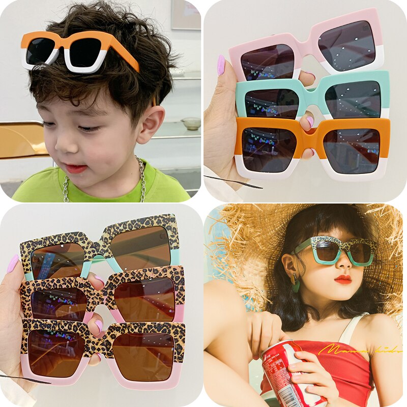 Smiling baby in leopard print sunglasses, enjoying the outdoors with effective eye protection.