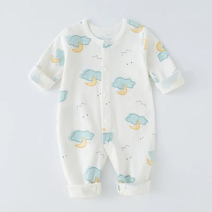 Baby girl smiling sweetly in a cozy, all-season cotton romper. Infant clothing.