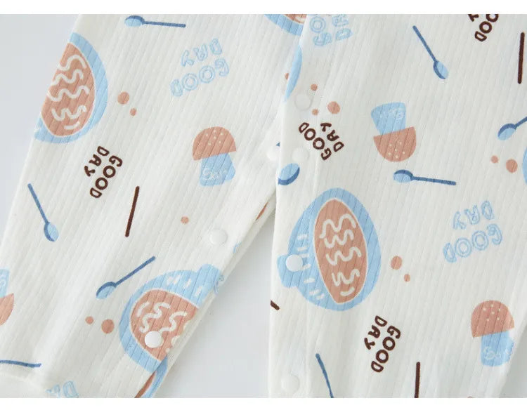 Soft cotton baby jumpsuit with snap closures, ideal for newborn boys and girls.