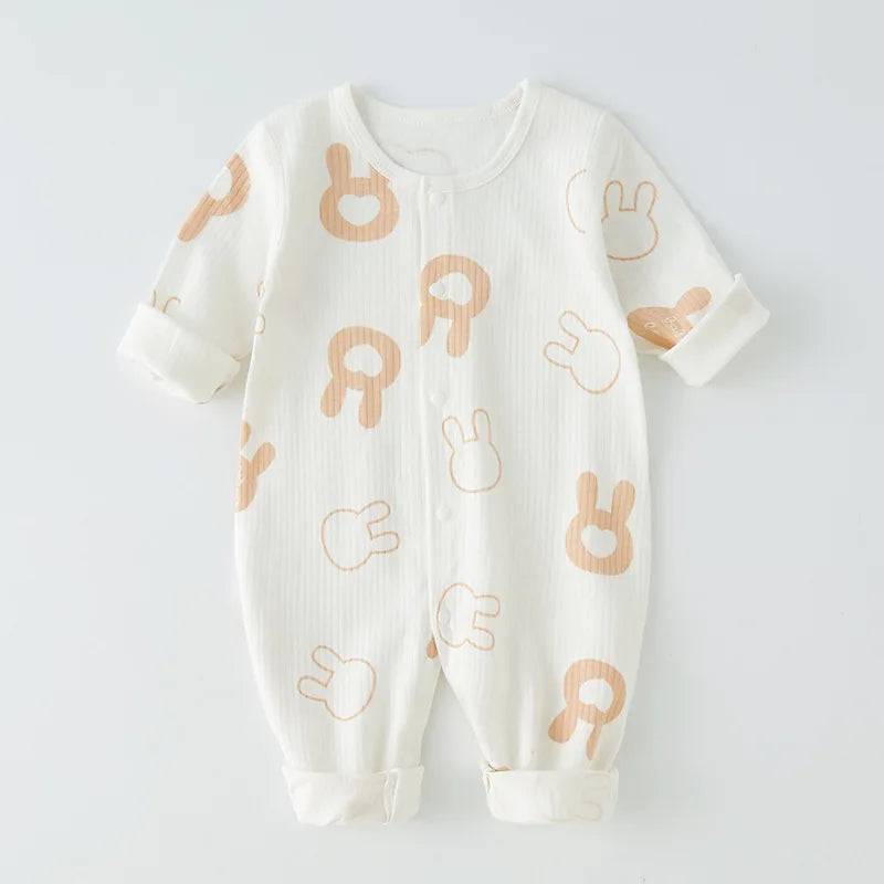 Happy baby in a premium soft cotton newborn romper, great for all seasons.