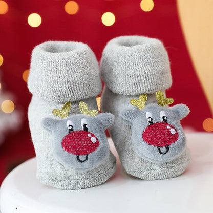 Close-up of a child's foot in a thick, warm, non-slip infant sock