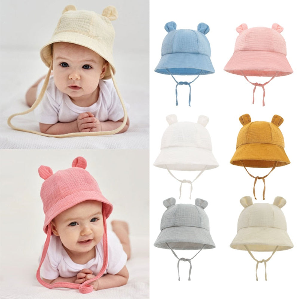 Adorable baby in white cotton fisherman sun hat, perfect for UV protection & summer adventures