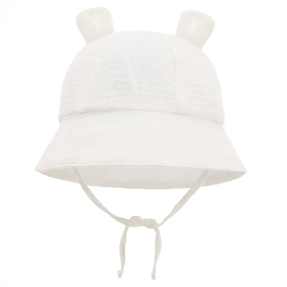 Toddler modeling a durable cotton fisherman sun hat, designed for active outdoor play