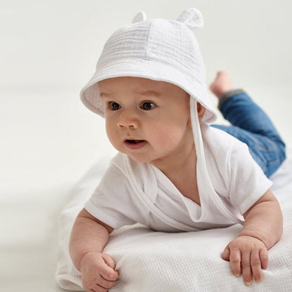 Close-up of a baby cotton fisherman sun hat, showcasing material texture & intricate stitching