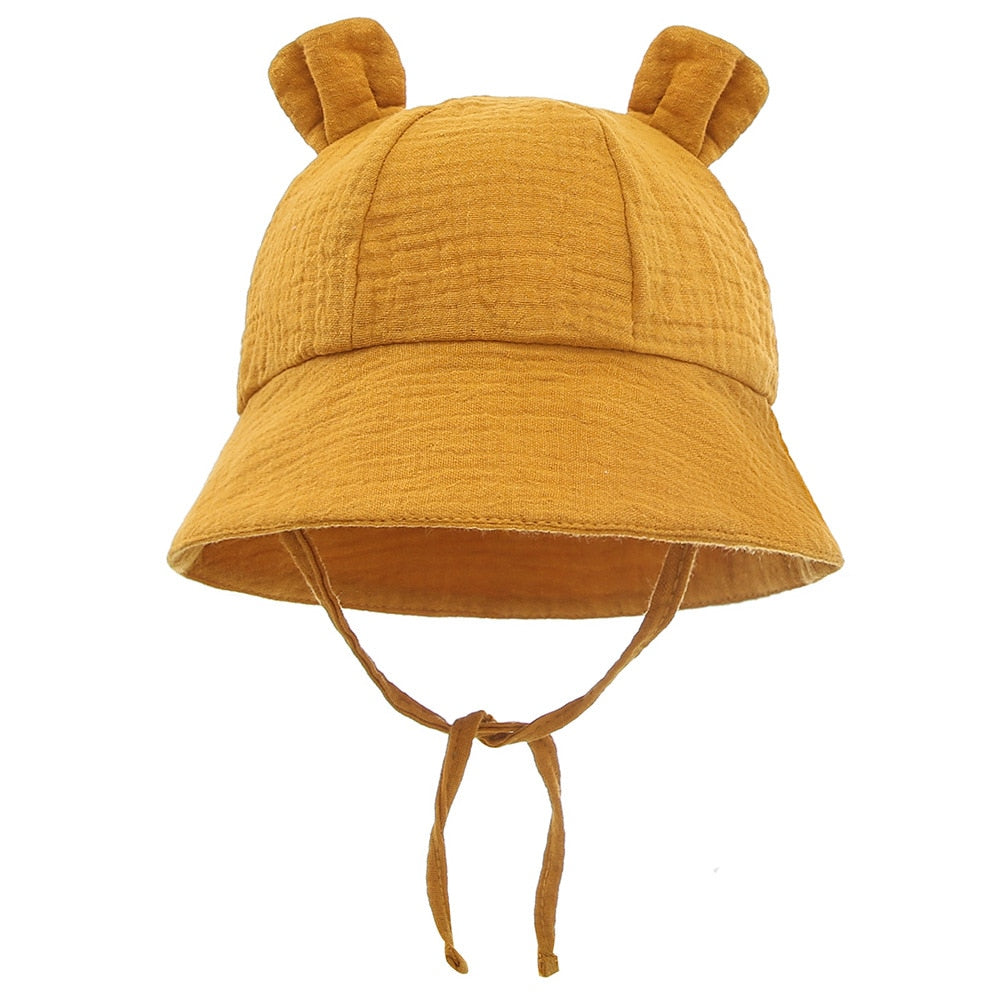 Close-up, soft cotton fabric of a blue toddler fisherman sun hat, ensuring comfort & safety