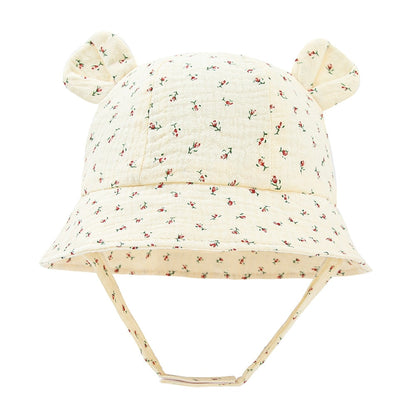 Baby wearing a versatile cotton fisherman sun hat, offering excellent UV protection on the go