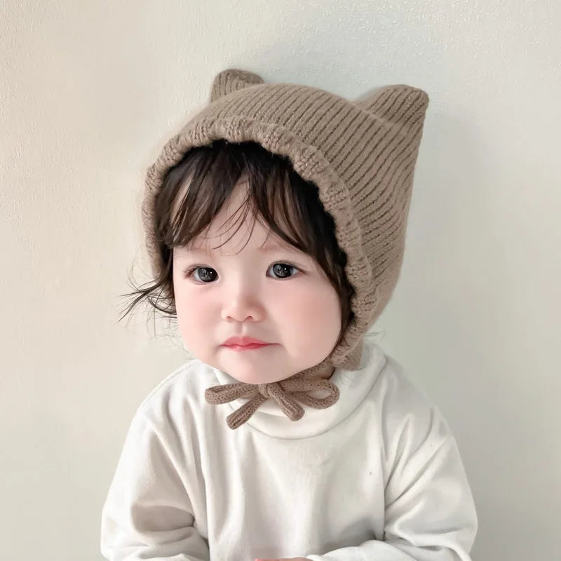 Toddler's cute cartoon knit beanie with ear protection, perfect for chilly days