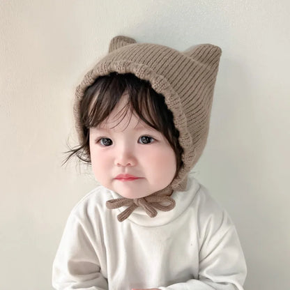 Toddler's cute cartoon knit beanie with ear protection, perfect for chilly days