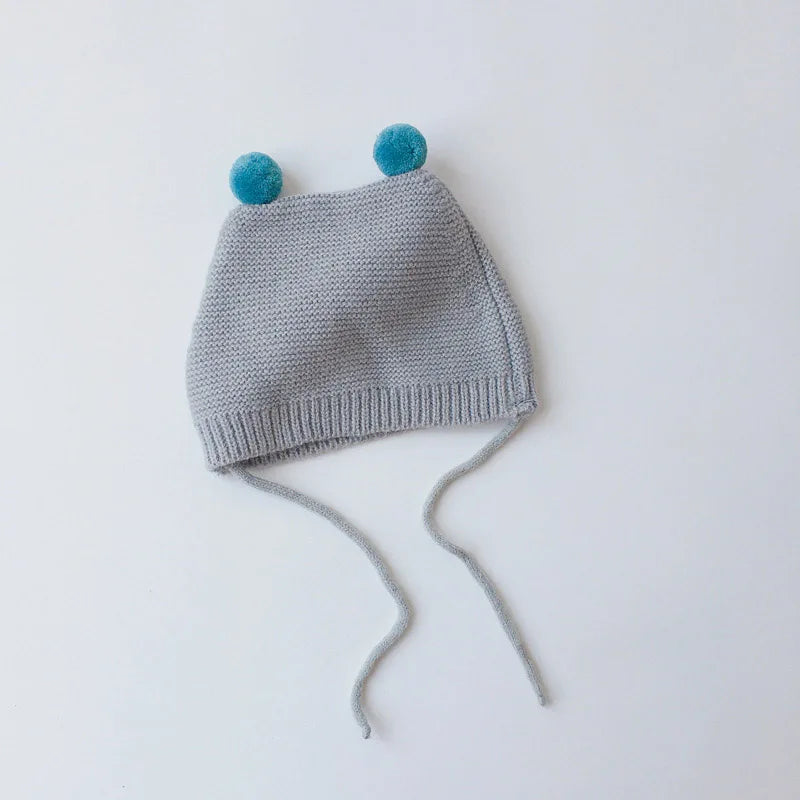 Knitted baby beanie, cartoon style with ear protection, a very warm winter hat