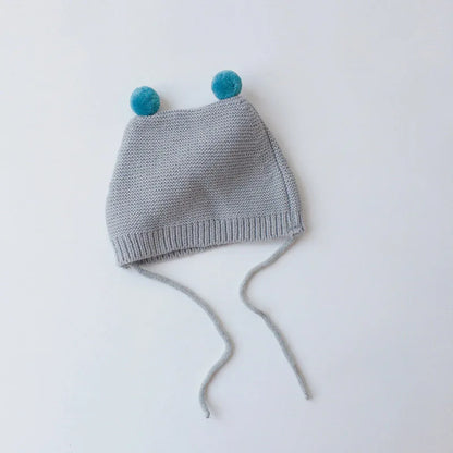 Knitted baby beanie, cartoon style with ear protection, a very warm winter hat