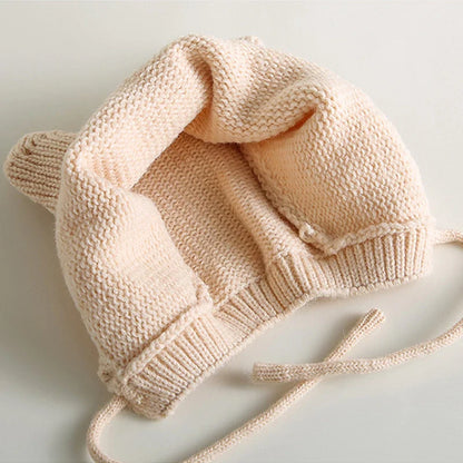 Toddler knit cartoon hat featuring ear protection, a cozy and warm accessory for winter