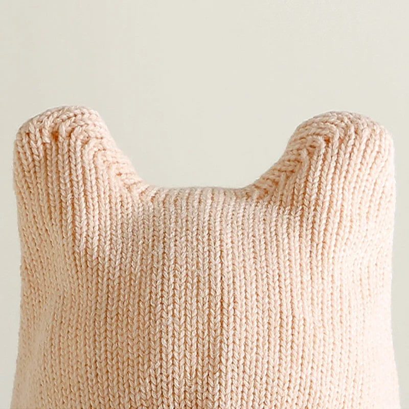 Baby's warm knit hat with a fun cartoon character and comprehensive ear protection