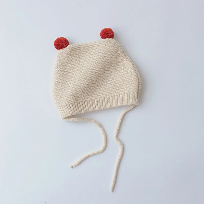 Warm toddler knit beanie, cartoon themed with ear flaps, ideal for winter outings