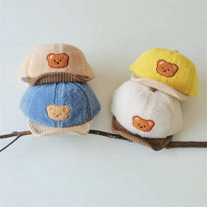 Adorable newborn bear ear cap, hand-knitted design, ensuring warmth and cuteness for infants.