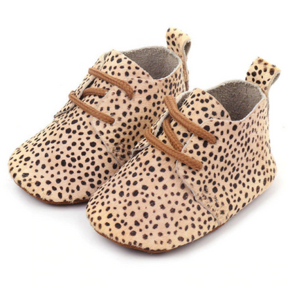 White genuine leather moccasins for baby, soft sole first walker shoes, essential anti-slip infant footwear.