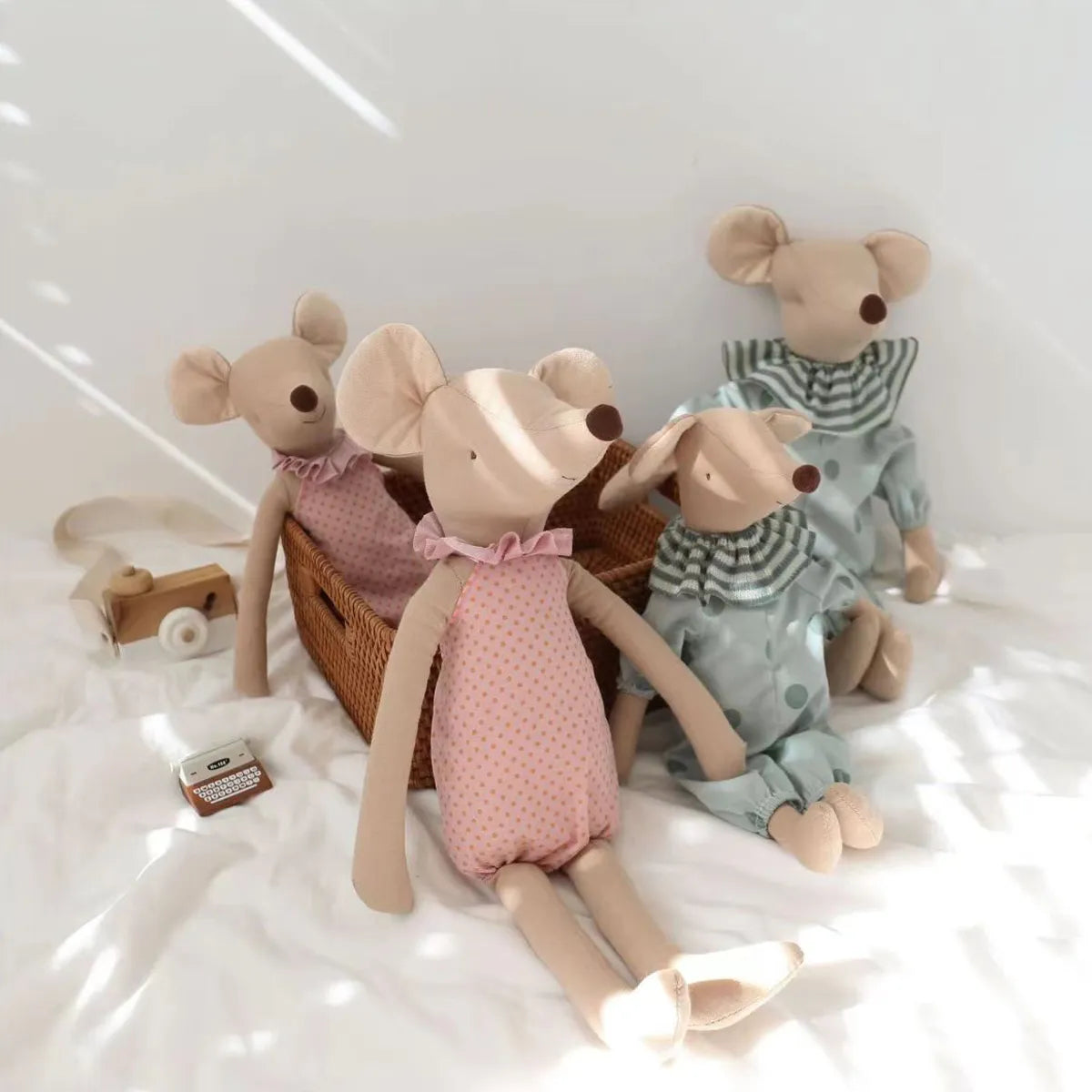 Adorable baby mouse plush toy, a soft stuffed animal perfect for nursery decor and baby gifts.