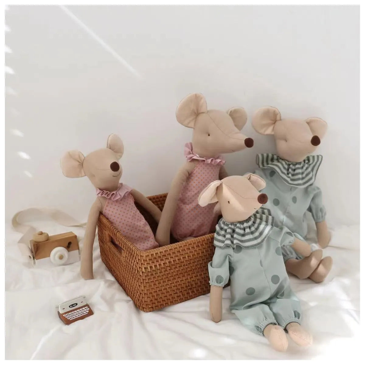 Collection of various colored baby mouse plush toys, vibrant and cuddly stuffed animals for kids.