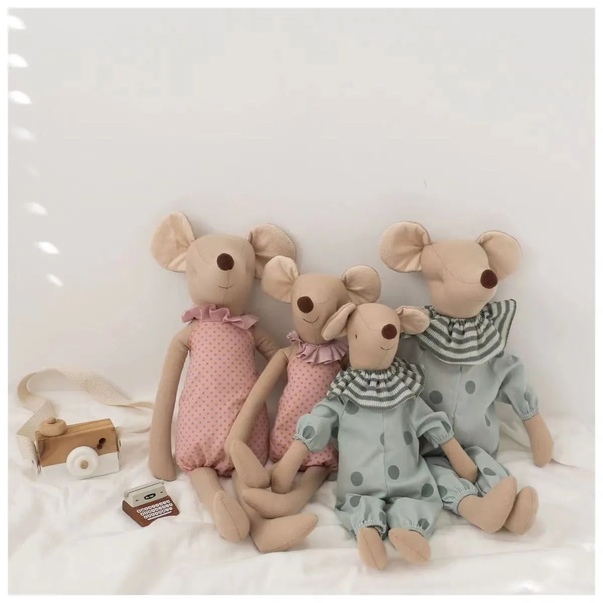 Baby mouse plush toy in a crib, illustrating its role as a perfect nursery decor item and comfort toy.