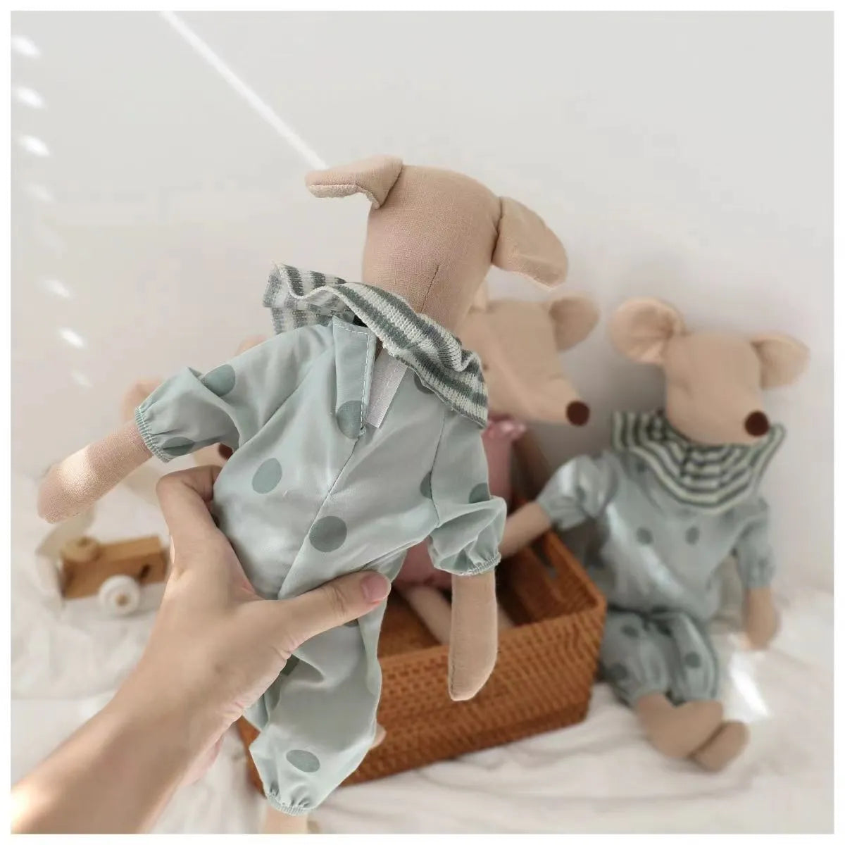 Child hugging a baby mouse stuffed animal, showing the toy's appeal and comforting nature.