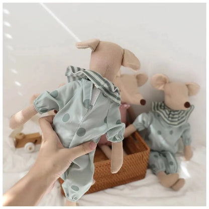 Child hugging a baby mouse stuffed animal, showing the toy's appeal and comforting nature.