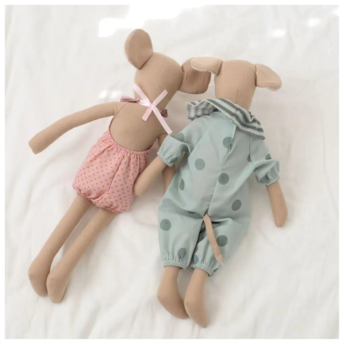 Top-down view of a baby mouse stuffed animal, highlighting its compact size and soft texture.