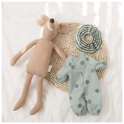 Hand holding a baby mouse stuffed animal, emphasizing its portability and softness for on-the-go fun.