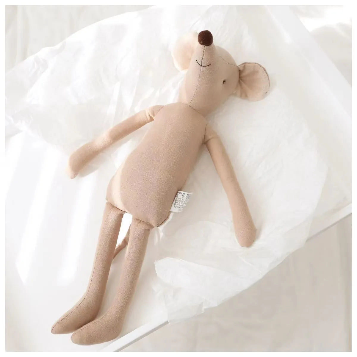 Plush toy mouse for babies, featuring a delicate bow tie, a lovely gender-neutral gift idea.