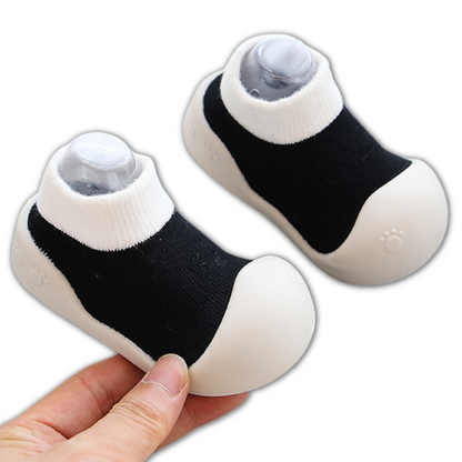 Pair of colorful infant soft sole shoes, designed as non-slip cotton booties for baby's comfort.