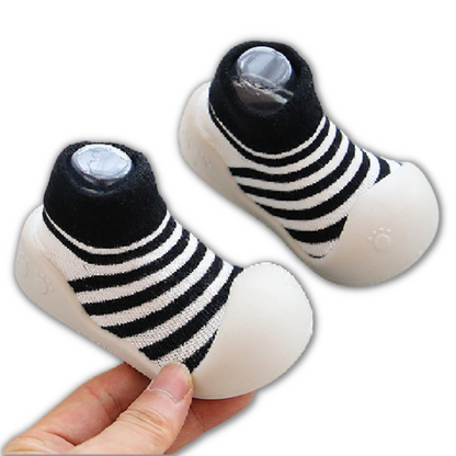 Vibrant non-slip baby walker shoes in soft cotton, ideal for infants learning to take first steps.
