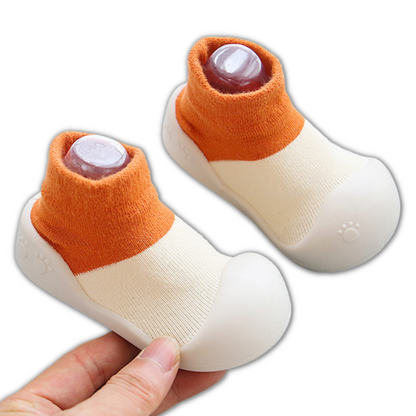 Comfortable cotton baby booties with a non-slip soft sole, excellent for new walkers and infants.